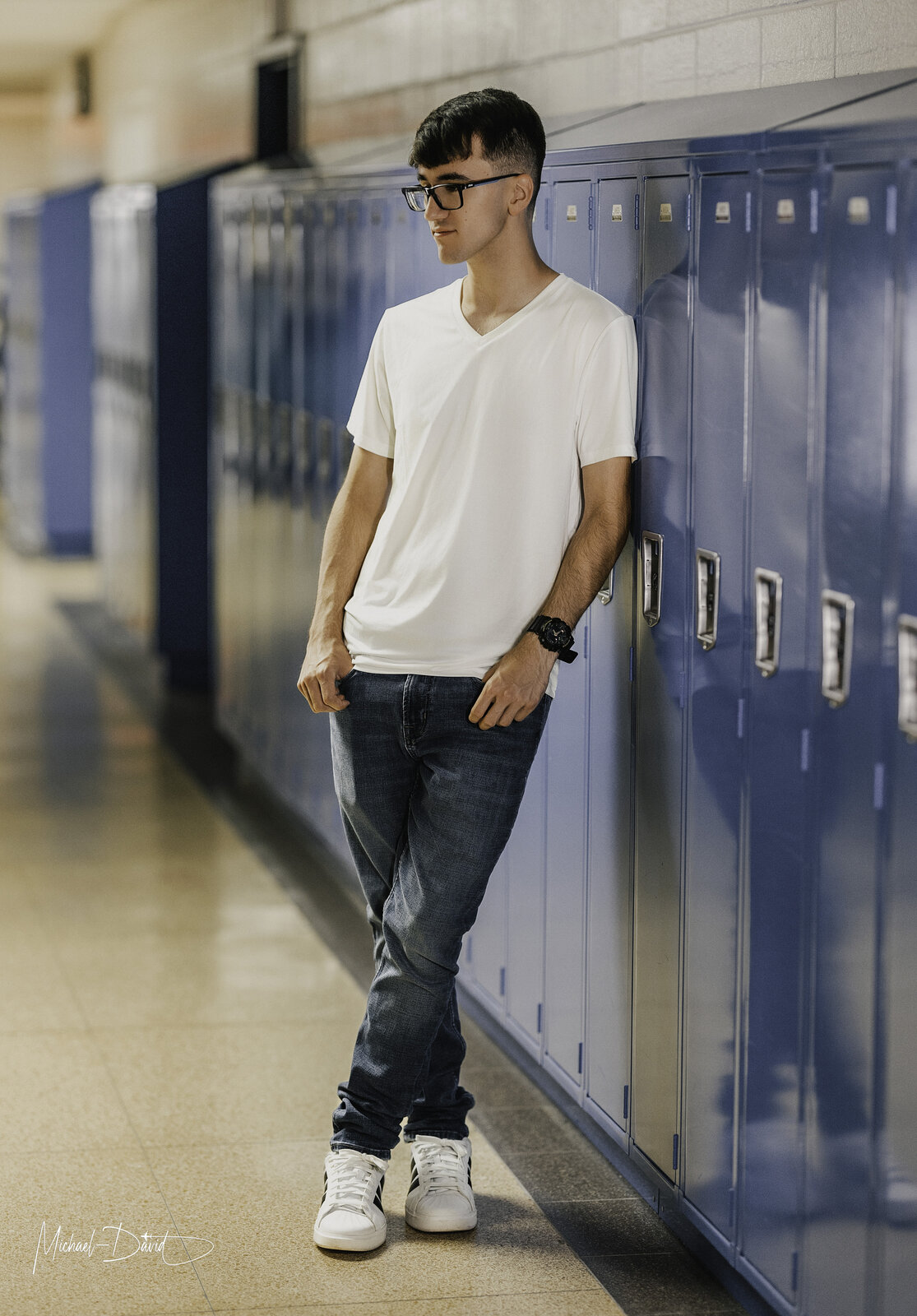 Zach leaning against the lockers