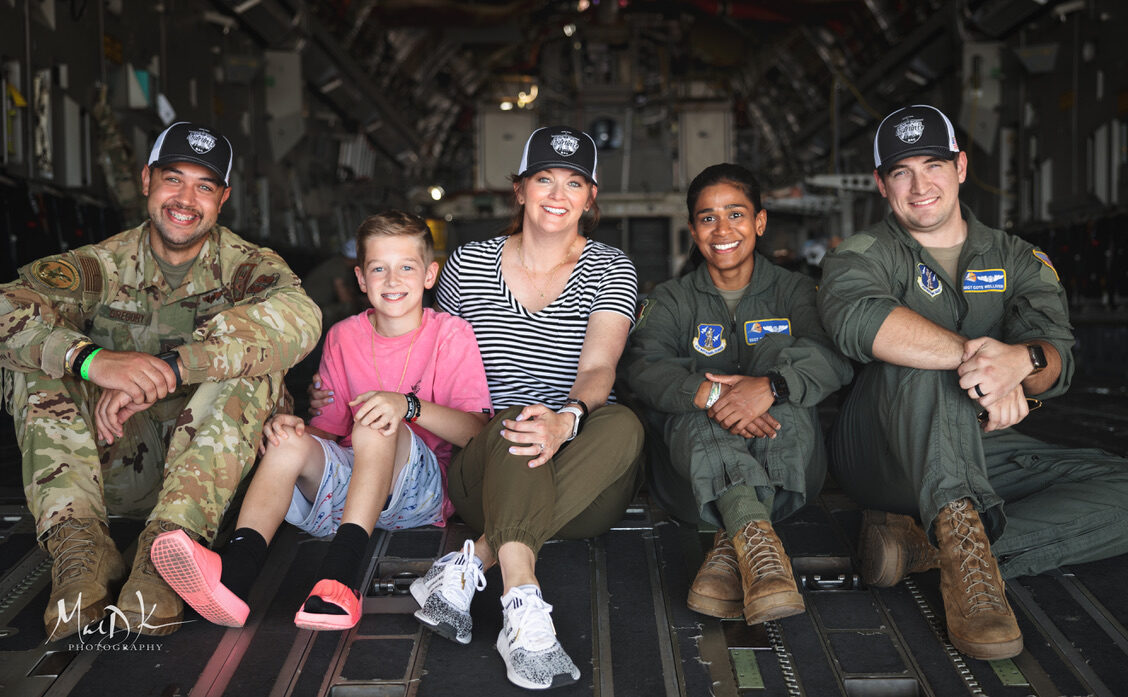 Visitors and aircrew gather in the cargo bay of a C-17 Globemaster III at the Sun 'n Fun Aerospace Expo.