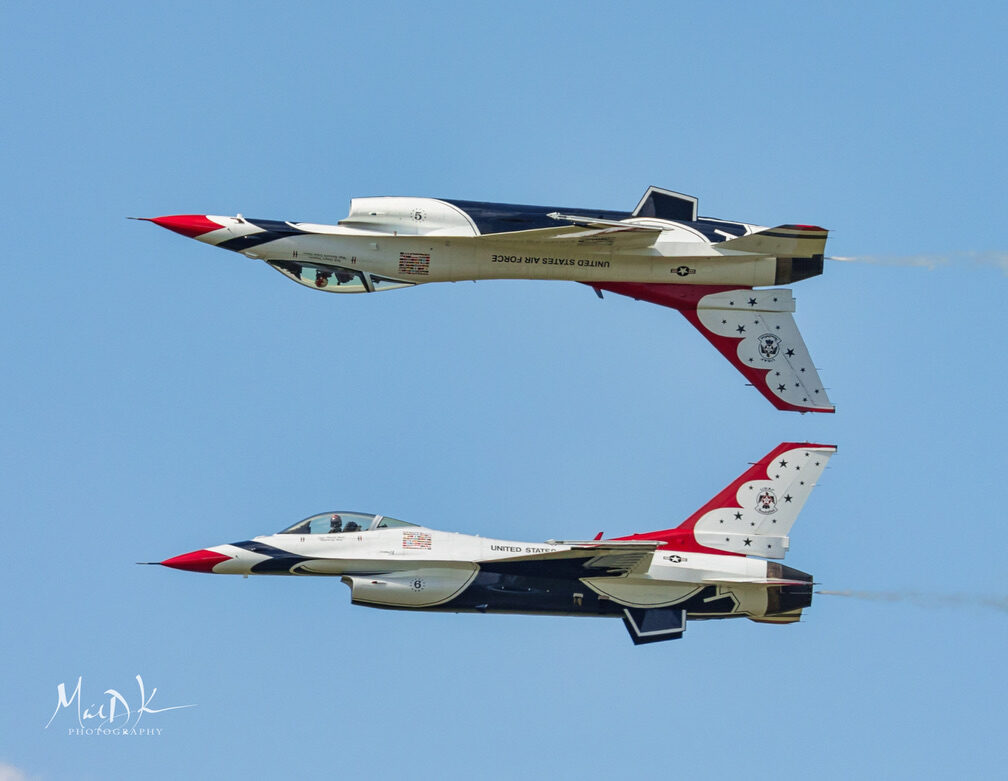 Two U.S. Air Force Thunderbirds F-16s pass canopy-to-canopy during the Sun 'n Fun Aerospace Expo.